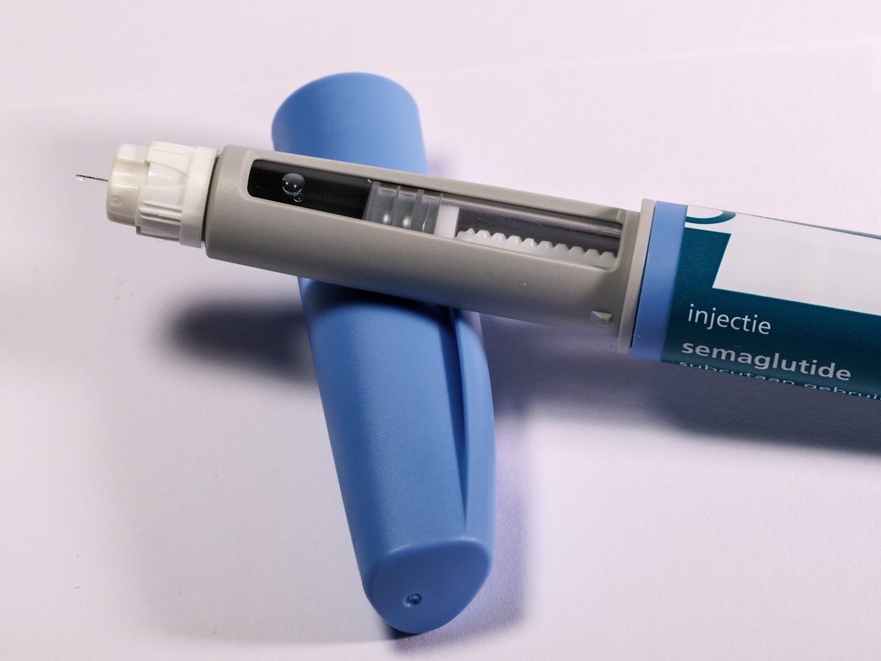 digital Detailed view of a semaglutide injection pen, commonly used for diabetes treatment, on a plain background.